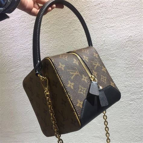 louis vuitton cube bag.